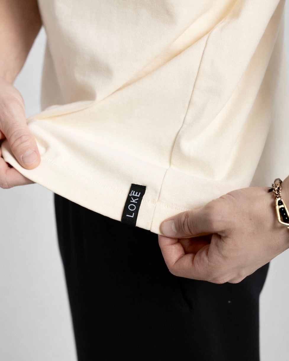 LOKE Pistols Tee Cream Woven Hem Label Detail